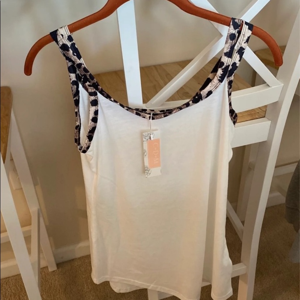 Brand new women’s tank top with tags.